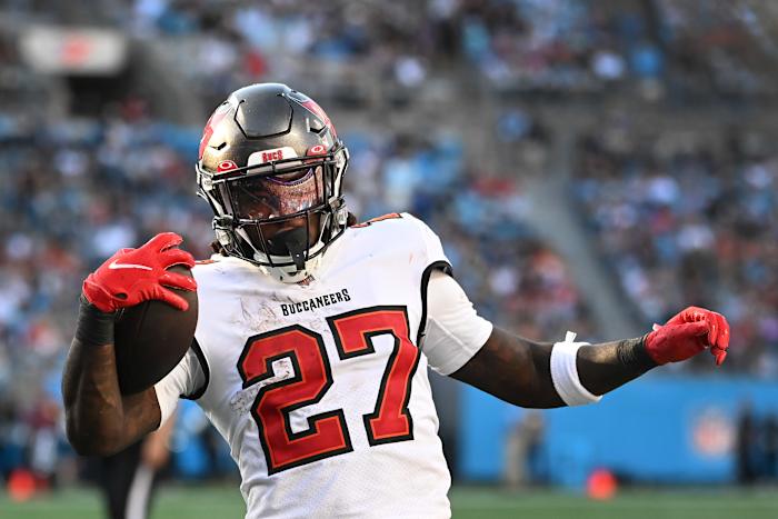Dec 26, 2021; Charlotte, North Carolina, USA; Tampa Bay Buccaneers running back Ronald Jones (27) scores a touchdown in the third quarter at Bank of America Stadium. Mandatory Credit: Bob Donnan-USA TODAY Sports